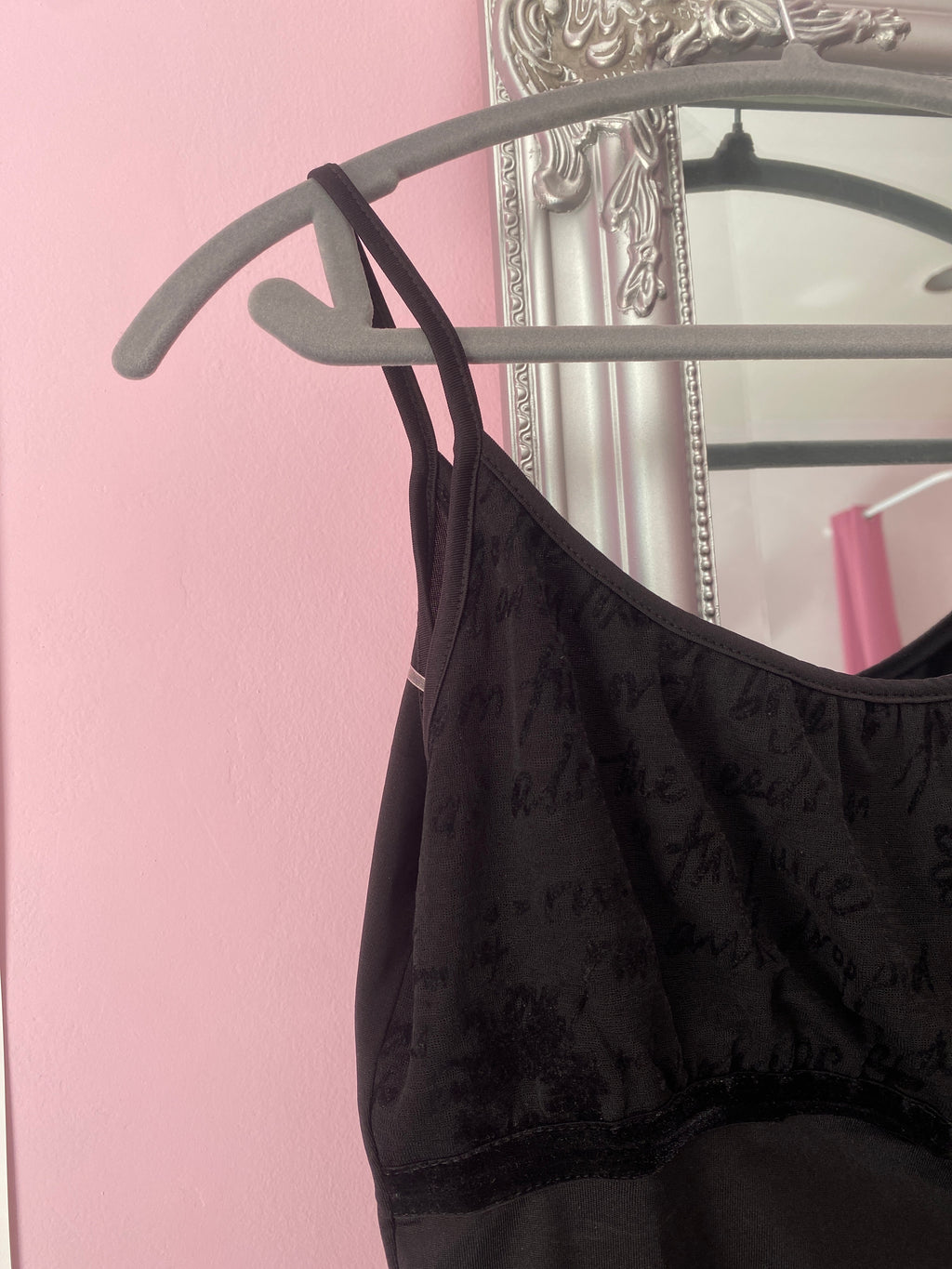 Black cami top with a sparkly heart