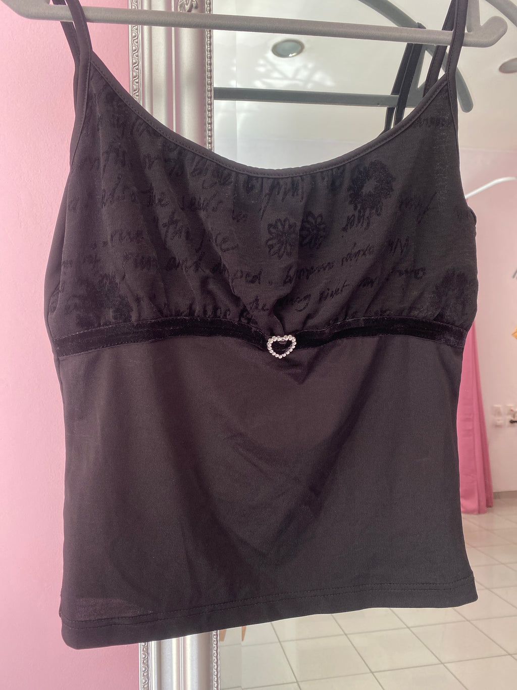 Black cami top with a sparkly heart