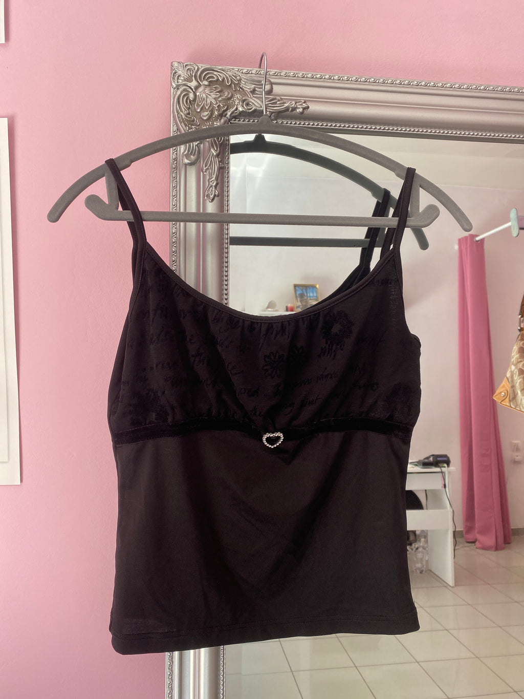 Black cami top with a sparkly heart
