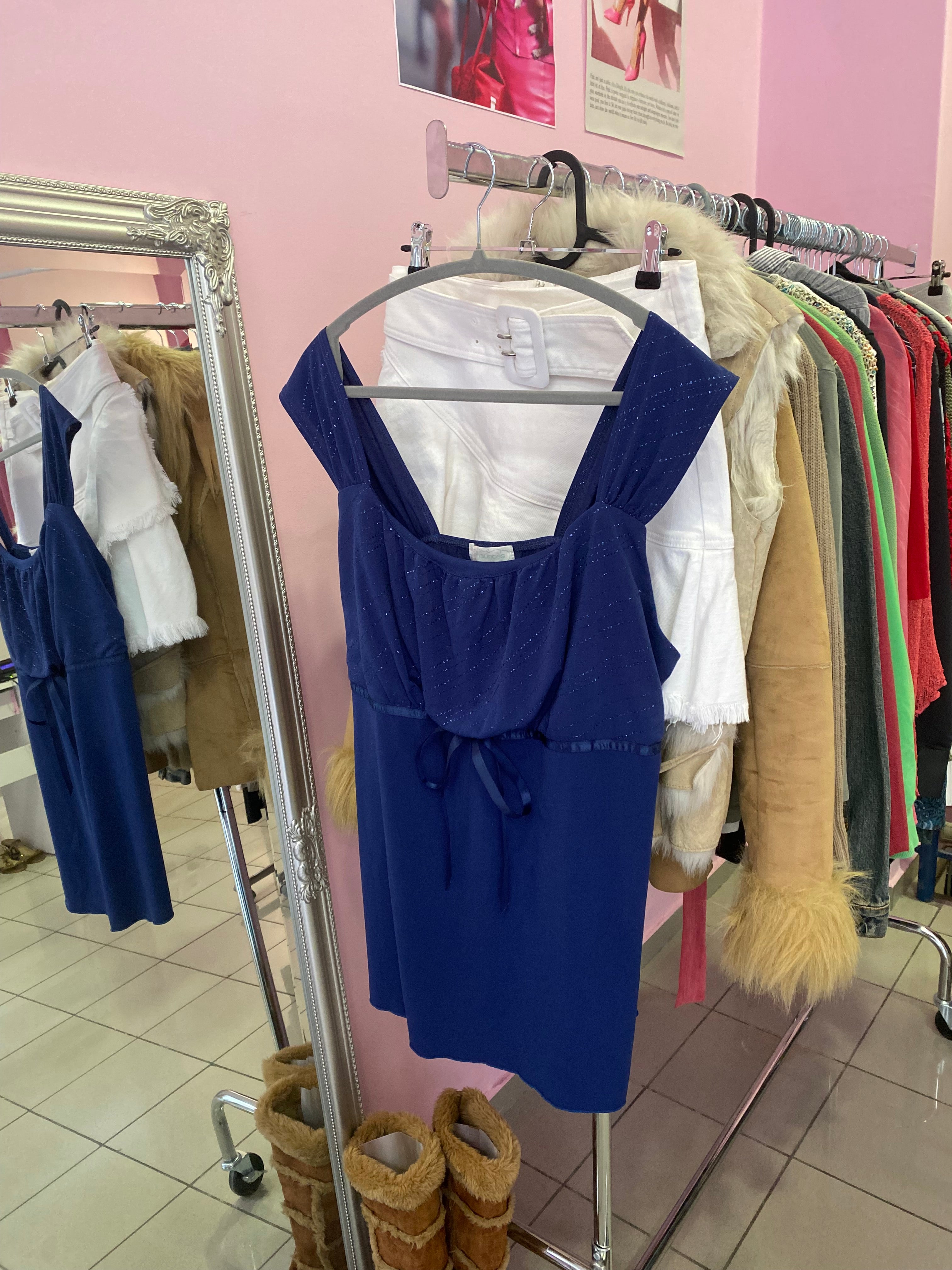 Blue sparkly top with a bow